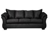 Full indoor shot of a black three-seat sofa. The sofa is a dark, solid black color. It features gently curved armrests and a slightly raised back, characteristic of a contemporary style. The cushions appear to be filled and are upholstered in the same material as the rest of the sofa. The sofa's lines are smooth and the overall impression is of a comfortable and modern piece of furniture. The sofa sits on four, visible, slightly angled, dark brown/black legs. The background is pure white, isolating the sofa as the central focus.