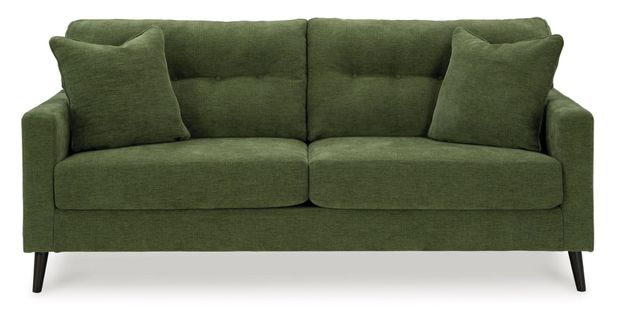 A dark olive green sofa is centrally positioned against a plain white background.   The sofa has a classic, padded, button-tufted back, and the upholstery has a subtle, textured weave. Two matching armrests are visible on each side. The sofa's legs are a dark brown or black wood tone. Two square accent pillows are placed on the back of the sofa. The couch appears to be modern and well-made.