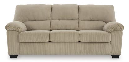 Full shot of a light beige or cream-colored three-seater sofa. The sofa has a corduroy-like textured fabric, with subtle vertical ribbed lines. The upholstery is a consistent tone. The sofa's arms are slightly flared and rounded, with a slightly tufted or quilted effect on the back and seat cushions. It has a classic, simple design with no embellishments. The sofa's legs are a dark, slightly brownish black color and are of a contemporary, slightly tapered design. The sofa is presented against a pure white background, which allows the color and details of the sofa to stand out clearly.