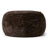 A large, round, plush pouf filled with gel memory foam, upholstered in luxurious crushed velvet fabric in a rich, dark brown color with subtle lighter highlights that create a textured, marbled appearance. The pouf has a soft, cushioned form with visible stitching along the top and sides, giving it a slightly segmented look. It sits against a plain white background, emphasizing its cozy and inviting design.