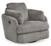 A cozy, modern armchair with a plush, ribbed fabric upholstery in a soft gray color. The chair features a wide, cushioned seat and backrest, with thick, padded armrests that curve gently outward for added comfort. The chair sits on a circular base, allowing it to swivel, and is set against a plain white background, highlighting its luxurious texture and contemporary style.