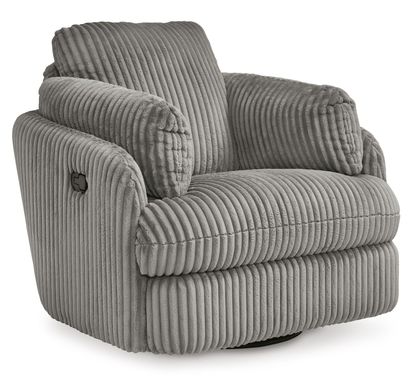 A cozy, modern armchair with a plush, ribbed fabric upholstery in a soft gray color. The chair features a wide, cushioned seat and backrest, with thick, padded armrests that curve gently outward for added comfort. The chair sits on a circular base, allowing it to swivel, and is set against a plain white background, highlighting its luxurious texture and contemporary style.